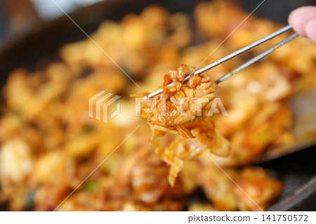 Spicy Korean Chicken Stir Fry Dakgalbi with Vegetables on Iron Pan 141750572