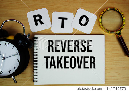 RTO Reverse Takeover text written on notepad with magnifying glass and alarm clock on wooden background RTO Reverse Takeover text written on notepad with magnifying glass and alarm clock on wooden background 141750773