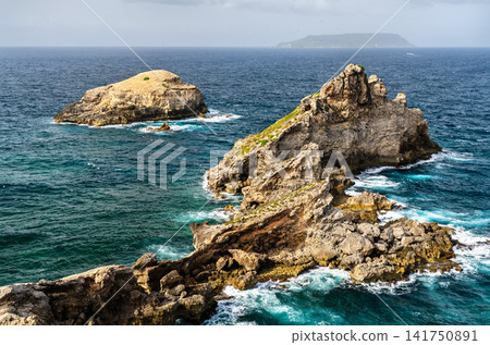 Dramatic rocky formations and ocean cliffs at Pointe des Chateaux in Guadeloupe, Caribbean. Dramatic rocky formations and ocean cliffs at Pointe des Chateaux in Guadeloupe, Caribbean. 141750891