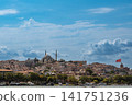 Istanbul, turkey, august 2, 2025 istanbul, turkey cityscape from the golden horn, featuring traditional architecture, the yavuz sultan selim mosque, and a flying turkish flag 141751236