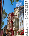 Istanbul, turkey, august 2, 2025 balat district showcasing traditional ottoman residential architecture with vibrant building facades under a clear blue sky 141751237