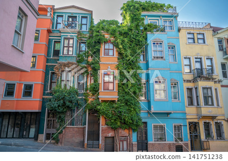 Istanbul, turkey, august 2, 2025 vibrant facades of traditional buildings in balat, a historic fener neighborhood, showcasing unique urban architecture and climbing ivy Istanbul, turkey, august 2, 2025 vibrant facades of traditional buildings in balat, a historic fener neighborhood, showcasing unique urban architecture and climbing ivy 141751238