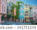 Istanbul, turkey, august 2, 2025 historic balat fener district showing vibrant traditional houses with lush green ivy in istanbul, a beautiful urban street scene 141751239