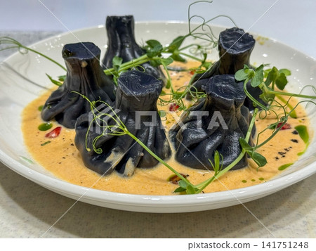 Black Khinkali In Creamy Sauce Black Khinkali In Creamy Sauce 141751248