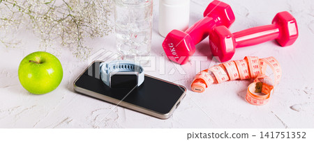 The concept of over-optimizing health through gadgets. A wellness set on a table. web banner The concept of over-optimizing health through gadgets. A wellness set on a table. web banner 141751352