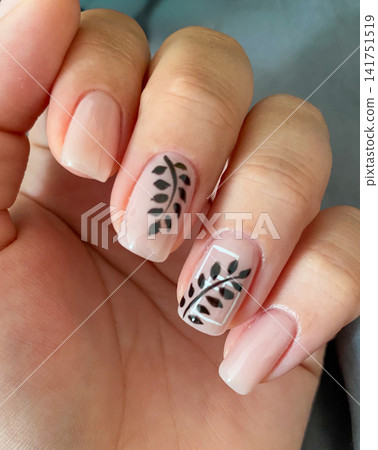 Nude Manicure With Black Leaf Design Nude Manicure With Black Leaf Design 141751519