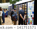 Men in shop of colored wooden panels 141751571