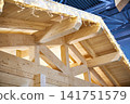 Frame of wooden house with festive garland 141751579