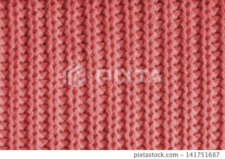 Close up, macro of red knitted fabric texture with yarn stitches, cloth wool background Close up, macro of red knitted fabric texture with yarn stitches, cloth wool background 141751687
