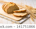 wheat bread with sourdough on white kitchen table, selective focus. 141751866