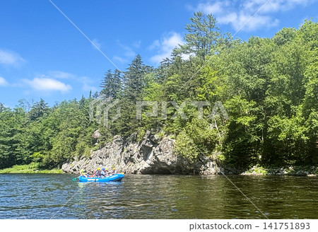 Rafting on the River Surrounded by Trees and Rocks in Summer Rafting on the River Surrounded by Trees and Rocks in Summer 141751893