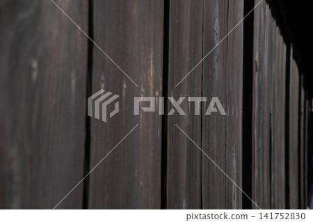The black wood-grain exterior walls seen in traditional Japanese houses, shrines, and temples. The black wood-grain exterior walls seen in traditional Japanese houses, shrines, and temples. 141752830