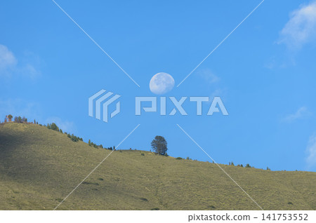 Full Moon Above Casitagua Mountain at Dawn in Pomasqui, Ecuador. Full Moon Above Casitagua Mountain at Dawn in Pomasqui, Ecuador. 141753552