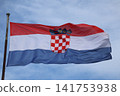 National flag of Croatia waving on flagpole against blue sky National flag of Croatia waving on flagpole against blue sky 141753938