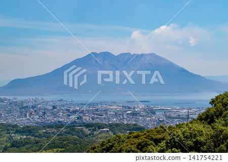 View of Kagoshima city and Sakurajima volcano from the Suzuyama Observatory on the Ibusuki Skyline. View of Kagoshima city and Sakurajima volcano from the Suzuyama Observatory on the Ibusuki Skyline. 141754221