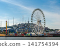 Giant Ferris Wheel La Perla and Cerro del Carmen from the Guayas River in Guayaquil, Ecuador 141754394