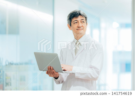 A man wearing a white suit A man wearing a white suit 141754619