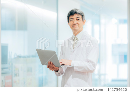 A man wearing a white suit A man wearing a white suit 141754620