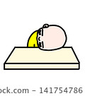 A toddler sleeping with their head on the table 141754786