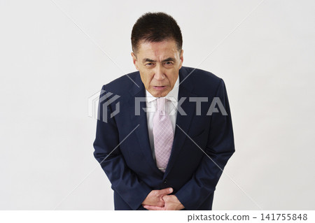 Senior businessman bowing his head, apology, white background Senior businessman bowing his head, apology, white background 141755848