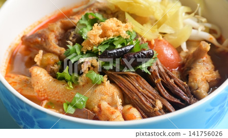 rice vermicelli with northern thai curry sauce on blue background rice vermicelli with northern thai curry sauce on blue background 141756026