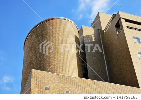 Abstract modern brown brick building architecture with curved design for professional urban concept background. Abstract modern brown brick building architecture with curved design for professional urban concept background. 141758165