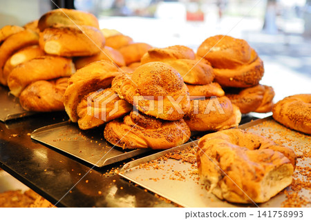 Fresh baked bread rolls at a local bakery in the morning Fresh baked bread rolls at a local bakery in the morning 141758993