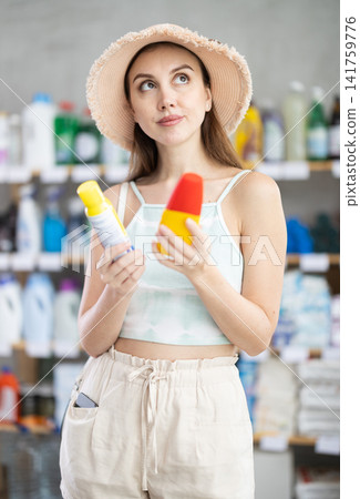 Woman view trademark sign on label, chooses eco friendly insect repellent Woman view trademark sign on label, chooses eco friendly insect repellent 141759776