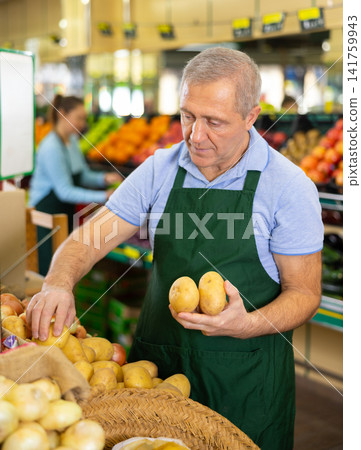male seller selling potato male seller selling potato 141759943