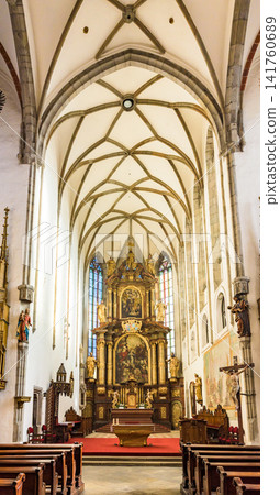 The interior of St. Vitus Cathedral in Český Krumlov, a UNESCO World Heritage Site, including its magnificent main altar and Gothic ceiling. The interior of St. Vitus Cathedral in Český Krumlov, a UNESCO World Heritage Site, including its magnificent main altar and Gothic ceiling. 141760689