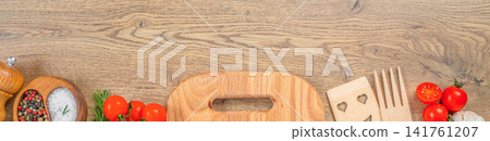 Rustic kitchen utensils and fresh ingredients on wooden table background with copy space, top view banner 141761207