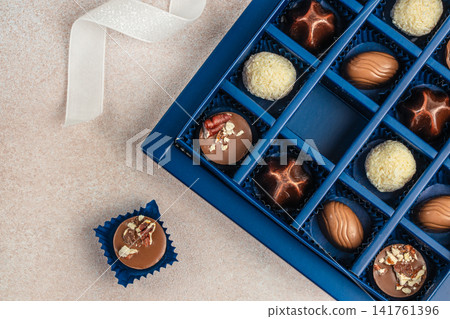 Luxury chocolate assortment in blue gift box Luxury chocolate assortment in blue gift box 141761396