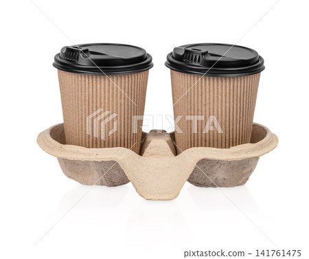 Two Takeaway Coffee Cups in Recycled Carrier Isolated on Light Background Two Takeaway Coffee Cups in Recycled Carrier Isolated on Light Background 141761475