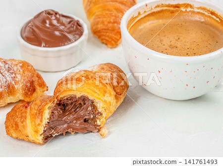 Chocolate Filled Croissant with Coffee and Hazelnut Cream for Breakfast Chocolate Filled Croissant with Coffee and Hazelnut Cream for Breakfast 141761493