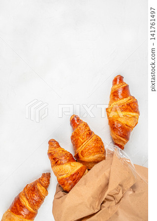Fresh Croissants in Paper Bag on White Background with Copy Space Fresh Croissants in Paper Bag on White Background with Copy Space 141761497