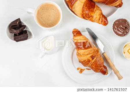 Croissant Breakfast Set with Coffee Chocolate and Butter Top View Croissant Breakfast Set with Coffee Chocolate and Butter Top View 141761507