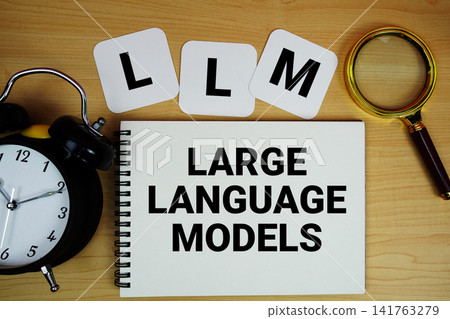 LLM Large Language Models text written on notepad with magnifying glass and alarm clock on wooden background LLM Large Language Models text written on notepad with magnifying glass and alarm clock on wooden background 141763279