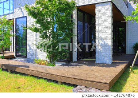 House with wide wooden deck (new house) House with wide wooden deck (new house) 141764876