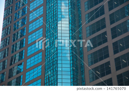 Clouds reflecting off office buildings in the business district Clouds reflecting off office buildings in the business district 141765070