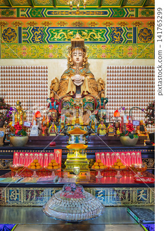 Golden statue and traditional altar offerings inside Thean Hou Temple, Kuala Lumpur, Malaysia Golden statue and traditional altar offerings inside Thean Hou Temple, Kuala Lumpur, Malaysia 141765299