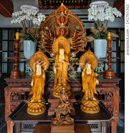 Buddhist altar with thousand-armed statue at Chua Linh Ung Pagoda in the Marble Mountains, Da Nang, Vietnam Buddhist altar with thousand-armed statue at Chua Linh Ung Pagoda in the Marble Mountains, Da Nang, Vietnam 141765302