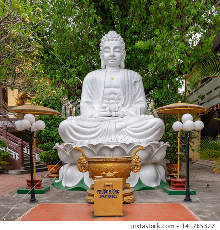 Large white Buddha statue on a lotus throne at Phap Lam Pagoda in Da Nang, Vietnam Large white Buddha statue on a lotus throne at Phap Lam Pagoda in Da Nang, Vietnam 141765327