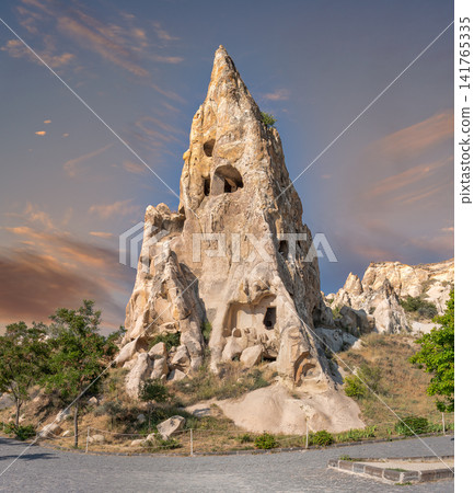 Ancient rock cut cave dwellings inside a fairy chimney at Goreme Open Air Museum in Cappadocia, Turkey Ancient rock cut cave dwellings inside a fairy chimney at Goreme Open Air Museum in Cappadocia, Turkey 141765335