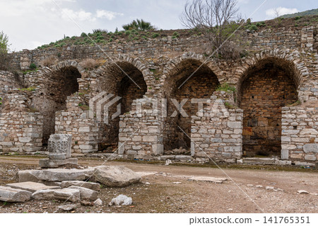 East Gymnasium ancient ruins with stone arches, Ephesus, Selcuk, Turkey East Gymnasium ancient ruins with stone arches, Ephesus, Selcuk, Turkey 141765351
