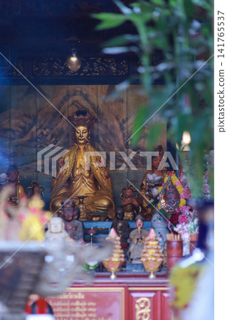 Standing Guan Yin and Guan Yin Shrine in Guanyin Temple near Wat Kalayanamitr Woramahawihan Standing Guan Yin and Guan Yin Shrine in Guanyin Temple near Wat Kalayanamitr Woramahawihan 141765537