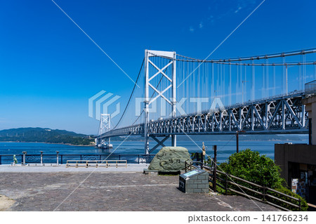 The Great Naruto Bridge is a massive suspension bridge spanning the Naruto Strait, connecting Naruto City in Tokushima Prefecture with Awaji Island. The Great Naruto Bridge is a massive suspension bridge spanning the Naruto Strait, connecting Naruto City in Tokushima Prefecture with Awaji Island. 141766234