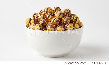 Bowl of sweet caramel popcorn drizzled with chocolate delicious confectionery appetizer snacking cravings isolated background lighting close-up homemade deliciousness indulgent Bowl of sweet caramel popcorn drizzled with chocolate delicious confectionery appetizer snacking cravings isolated background lighting close-up homemade deliciousness indulgent 141766651