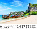 Traditional Thai longtail boats anchored on the white sand of Railay Beach near Ao Nang, Krabi in Thailand. 141766883