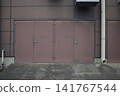 A landscape lined with rusty doors 141767544