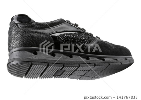 Women black mixed-media fashion sneaker isolated on white background. Casual running shoe with suede, patent leather and rhinestones, side bottom view. Women black mixed-media fashion sneaker isolated on white background. Casual running shoe with suede, patent leather and rhinestones, side bottom view. 141767835